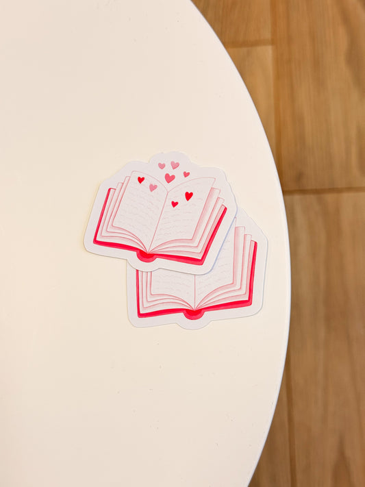 Open Book with Hearts sticker met boek en hartjes voor romance readers.